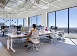 Gensler Oakland
Organized into multiple components that support a design firm’s unique practice, the core-centric space has sit-stand desks, benching tables and drop-in stations around the perimeter, with conference and small meeting rooms around the core and a large flexible project area on the south end of the floor. Each area of the office is distinguished by its deliberate form and honest expression of materials.