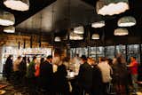 The custom steel wine wall is the seventh one to be installed at separate Barcelona Wine Bar &amp; Restaurant locations in the last 10 years.