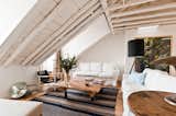 Ultramar is the largest apartment in the building with three bedrooms and two bathrooms. The original wooden beams were left exposed and painted white, and the skylights were restored to allow for natural light.