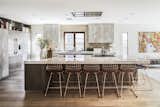 One of the elements that Lefebvre had his heart set on was a copper sink, though it didn’t go along with the rest of the decor; the copper bar stools were a serendipitous find that tied the room together.  Photo 2 of 8 in Chef Ludo Lefebvre's Modern Kitchen With Rustic Roots