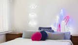 Eye! Eye! Eye! ($449) and Crystal Prism ($449) decorate a bedroom. Electric Confetti's designs come with a remote control that allows you to dim the neon to less than 5% brightness, ideal for a nightlight, or set it to an adjustable flashing speed.  My Saves from Next-Generation Neon