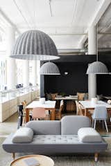 Muuto Under the Bell pendant lights are made from recycled plastic felt, which helps absorb noise and improve acoustics—a key feature in the open office.