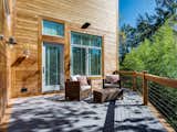 Approximately 516 square feet, the back deck is comprised of two-toned cedar and gray composite wood. Four all-weather speakers provide entertainment, and the reinforced left side allows for hot tub installation.&nbsp;