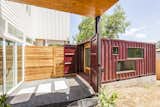 The two units in the duplex share a wall in the main house, so Rios continued the mirrored effect by placing the shipping containers side by side about 10 feet away from the home. Cut into the sides, the windows allow natural light to illuminate the shipping container and are designed to give parents a view of the kids playing in the backyard.&nbsp;