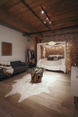 The sleeping area is tucked into the back of the loft. Says Misra of the clients, "As they moved in and felt the energy of the place, they admitted they could see themselves staying here more and more and commuting less and less."&nbsp;