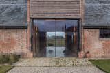 Two oversized glazed sliding doors welcome guests into Church Hill Barn.