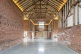 The renovation honors the grand, cathedral-like proportions of the original barn. In addition to the