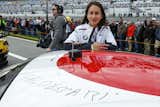 McGough poses with the car, which bears Baldessari's signature. "Having never been [to a race] before, I naively thought the sound of a car would be overwhelming, but it was exhilarating," she says of the Rolex 24. "It just made my heart pump."&nbsp;