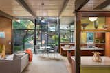 The kitchen and den, pictured above, as well as the living room and covered veranda open up to the backyard thanks to large glass walls. The rear of the house was rebuilt by architect Rufus Turner following a fire in the living room in 1964.  Photo 4 of 11 in Snag This Midcentury Stunner in Southern California For $799K