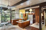 Carpeting, cork, and tile flooring run throughout the house, which is T-shaped in floor plan.  Photo 6 of 11 in Snag This Midcentury Stunner in Southern California For $799K