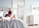 You can remotely turn on the shower and set it to automatically pause after heating up, adjust the temperature, or turn the outlets on and off—all from your phone.  Photo 3 of 5 in Create Your Personal Oasis With U by Moen Shower
