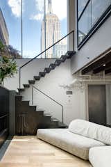 Gilsey House rooftop penthouse staircase with black metal tread and black-finish steel railing