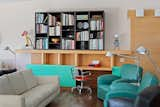 Custom built-in furniture is found throughout the home, such as this piece in the living room. Sottsass's Tahiti lamp, an abstracted and geometric bird shape, was designed for the 1981 Memphis collection, and his Valentine typewriter for Olivetti turned a piece of office equipment into a fashion accessory. &nbsp;