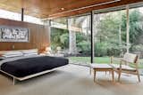 Bedroom, Bed, Carpet Floor, Chair, and Ceiling Lighting  Photo 11 of 13 in Hassrick Residence by Dwell from The Stunningly Restored Hassrick Residence by Richard Neutra Hits the Market at $2.2M