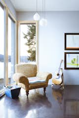 Living Room, Chair, and Pendant Lighting A family room is another flexible living space awash in natural light.  Photo 6 of 11 in A Rock & Roll Hall of Famer’s Picturesque Montana Retreat Is Going Up For Auction