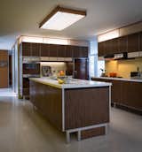 Paul McCobb designed the kitchen, built-in shelving units, and vanities throughout the abode. All the original General Electric appliances are in working order.