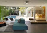 Living Room, Sofa, and Concrete Floor  Photo 1 of 9 in Norwich Drive Residence by Dwell from Tobey Maguire Snatches Up Googleplex Architect Clive Wilkinson’s Los Angeles Home For $3.4M
