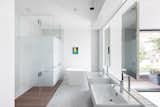 Bath Room, Full Shower, Freestanding Tub, Wall Mount Sink, Medium Hardwood Floor, Ceiling Lighting, Recessed Lighting, and Marble Floor  Photo 1 of 4 in Idea book by David Bauer from Wrapped in Galvanized Steel, ‘Cube House’ in Vancouver Asks $12.8M