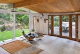 The main bedroom opens onto the deck and benefits from full-length windows for an indoor/outdoor sanctuary.