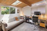 The second bedroom, punctuated by another skylight, can also be used as an office.