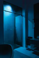 The en-suite bathroom also features a spacious steam shower.