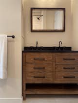 You may not be stuck with the existing dimensions of your tiny bathroom. If things feel too cramped and size-appropriate design options do not fit your desired aesthetic, ask a qualified professional if it’s possible to change the size of the room. Changing the configuration allows you to add a larger vanity, more shelving or cupboards, extend your shower, and more.