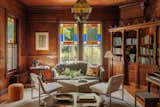 Other than blocking off some exposed plumbing and repairing the fireplace, the team left the library relatively untouched. "We wanted to preserve all the beautiful wood and stained glass and add a couple modern pieces,