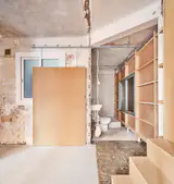 An MDF sliding door partitions the bathroom.