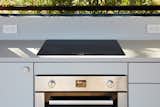 The 500 Series Single Wall Oven features heavy-duty knobs to control temperature and cooking modes. It uses a third heating element and fan to get consistent, even cooking.  Photo 3 of 5 in The Dwell House Kitchen May Be Compact, But It Packs a Punch