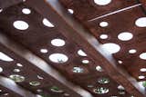 Detail of galvanized structure and shadow panels. The warm color comes from the outdoor fireplace's flames reflecting on the metal. It shimmers with the flames, putting the structure and fire in harmony.
