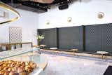 BIT UNION AKERSGATA (OSLO): A seemingly open seating area is slyly intimate thanks to subtly divided upholstered leather banquettes. Sections are paired with adjustable tables, each distinct from the next---alternately fabricated from wood, marble and brass.

Photo: Paul Paiewonsky
