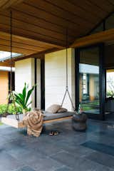Nicole Hollis designed this contemporary home in Hawaii for a couple who were Southern California natives that fell for the coast of Kona long ago. The home boasts indoor/outdoor living that’s complete with a relaxing bench swing to enjoy the Hawaiian breeze.

Photo courtesy of Laure Joliet  Photo 4 of 6 in Ideas by Peter Reveles from 10 MODERN OUTDOOR SPACES WITH SWINGS FOR RELAXING