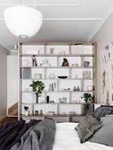 #designmilk #northbourne #architecture #melbourne #modern
Photo by Eve Wilson

A bookshelf was built as a room divider between the bedroom and closet.  Photo 9 of 21 in A Melbourne Home is Renovated for a Growing Family by Design Milk