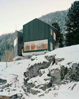 Lacroix Chessex Architectes realized La Maison aux Jeurs, a cabin in Les Jeurs, Switzerland situated on a rocky hill above the road. The structure is divided into two volumes that are angled 45 degrees apart with a connection on the mountain side. Both volumes are designed with different views of the valley below.