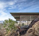 The Frey House II was built in 1964 by architect Albert Frey with mostly glass walls that frame the surrounding rocky landscape. The house even incorporates the massive rocks inside where many would have excavated the material or chosen not to have built there.