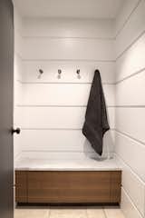 The Free Float Pool House's interior changing room features white wall panels with reveals for visual interest.