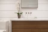 The cabana bathroom's custom vanity provides storage with a contemporary feel.