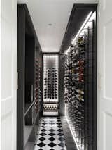 Sydney Joinery installed the Cellar Rack wine storage system.  Some red was added to this black and white colour scheme.   Photo 8 of 21 in Twin Peaks by Luigi Rosselli Architects