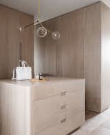 The dressing room joinery was designed by the project architect, Sean Johnson & Romaine Alwill in collaboration and includes a central drawer and dressing table unit. A slot connects to the ensuite master bathroom.  Photo 1 of 22 in Hill Top Cottage by Luigi Rosselli Architects