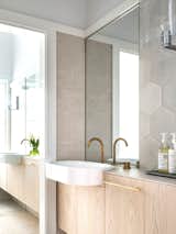 An unusual suite of Powder Room and Guest Bathroom, with a mill finish. Matt brass Broadware taps and spouts and Poppham “HEX” encaustic tiles.  Photo 1 of 22 in Hill Top Cottage by Luigi Rosselli Architects