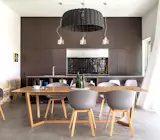 The Romaine Alwill selected CULT table and chairs provide warmth and complement the polished concrete slab, anthracite splash back and “Namadji” painted joinery. The kitchen benchtop is a mill finish zinc, constructed by Sydney Joinery with a bevelled edge. The zinc ages more gracefully than stainless steel, it is traditionally used on bistro benchtops in France where “eau de vie” provides a warm patina.