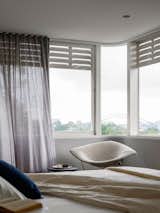 Sydney Harbour Bridge view from the bed reflected in the Dedece Bertoia “Diamond” reading chair.