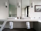 Also with city views, the master ensuite bathroom features a graphicly angular corian benchtop, Lea Ceramica tiled floor carara marble bath surround and pure untiled walls. The morning ablutions are performed in a “cabinet d’ etude”, a study like space.
© Justin Alexander

