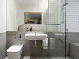 The main bathroom is located in the 1920s part of the apartment and so features metro style ceramic tiles with the exceedingly tight grout joints characteristic of the period.
© Justin Alexander