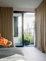 All floors have a view. The main bedroom bed could be linked to the city office with a flying fox. Classic Diamond Chair by Harry Bertoia. Curtains by the Curtain & Blind Factory
© Justin Alexander