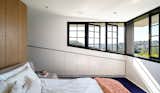 Horizontal openings offer a panorama that spans from Sydney Harbour, across the leafy hills of the Eastern Suburbs: Woollahra, Double Bay, Bellevue Hill and Bondi Junction. All the windows can be opened, outside shutters fold and deep eaves provide ample sun protection.
© Justin Alexander

