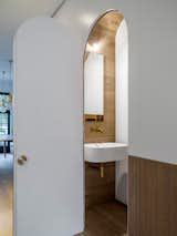 Preparing for a commission to design the new Airbus toilets, Luigi Rosselli Architects have experimented with compact design for such situations with the understairs powder room.
© Justin Alexander

  Photo 10 of 22 in Bougainvillea Row House by Luigi Rosselli Architects