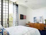 The tall French doors open inwards, European style, thanks to the ceiling rising in their proximity.
© Justin Alexander