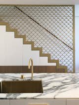 Another CNC routed aluminium panel, which continues the melodic theme of Schinkel’s fish scales adopted for the house, provides a contemporary solution to stair design that meets the building code.
© Sean Johnson

