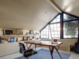 The study space over the garage is conceived as a cave for a modern man, with walls lined in limed hoop pine boards with matching bookshelf and flooring.
© Justin Alexander

